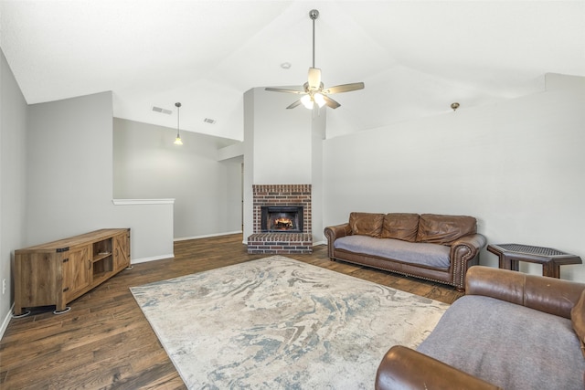 living room with dark hardwood / wood-style floors, ceiling fan, lofted ceiling, and a fireplace