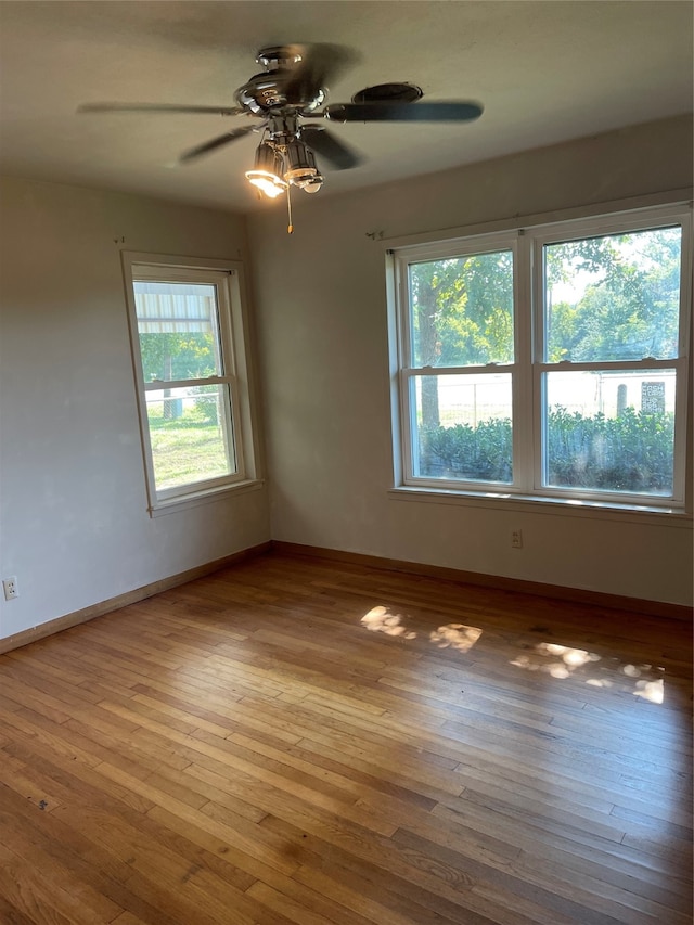 unfurnished room featuring ceiling fan and light hardwood / wood-style floors