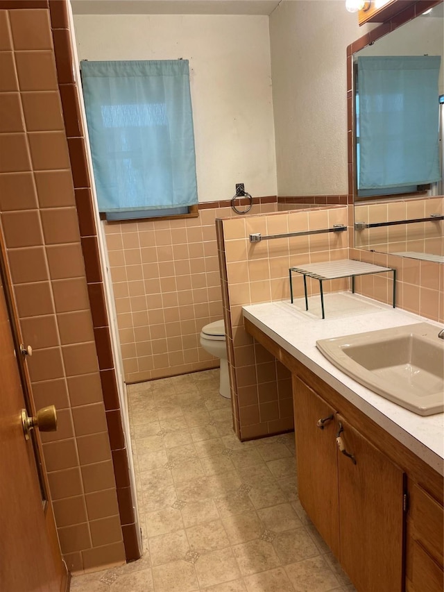2633 State Highway 59 N, Bowie, TX 76230 - bathroom with tile walls, toilet, and vanity