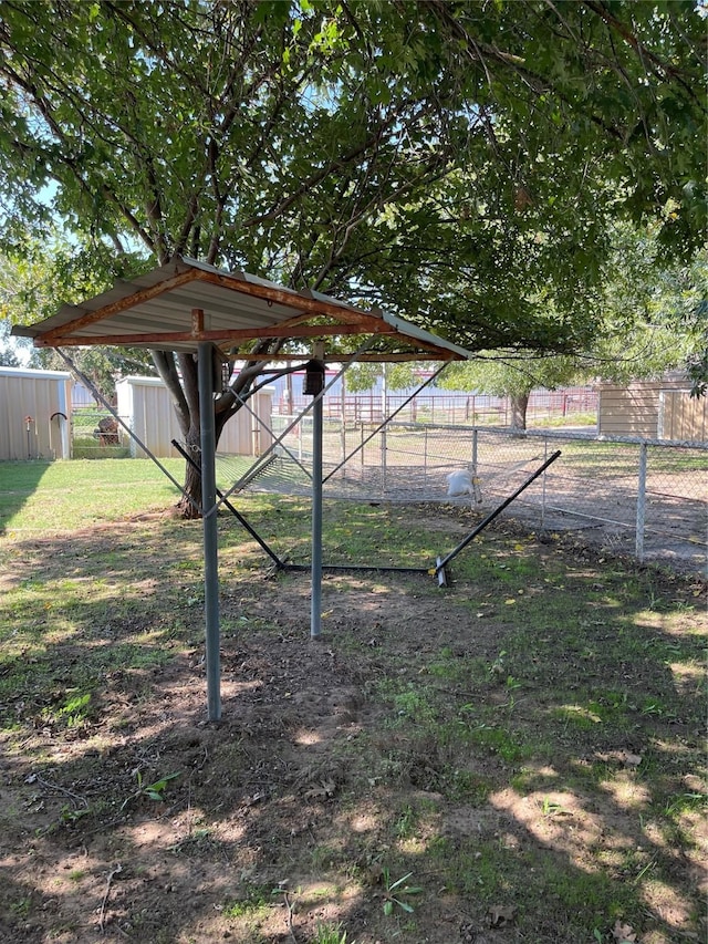 2633 State Highway 59 N, Bowie, TX 76230 - view of yard with a storage shed, an outbuilding, and fence