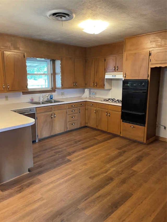 2633 State Highway 59 N, Bowie, TX 76230 - kitchen with visible vents, a sink, dark wood-type flooring, a warming drawer, and oven