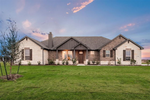 view of front of house with a yard