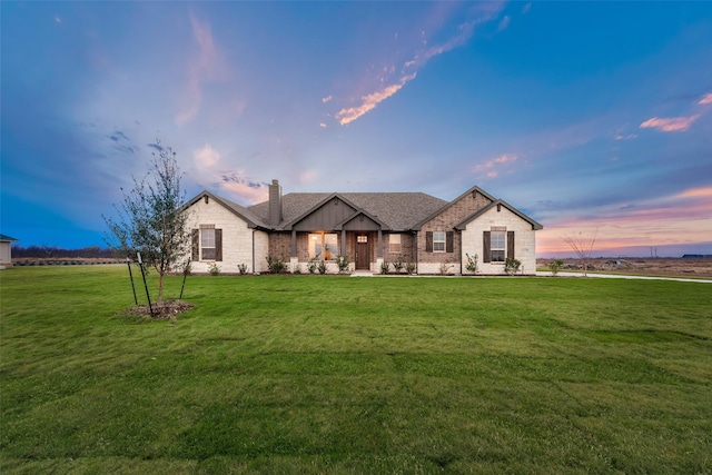 view of front of house with a lawn