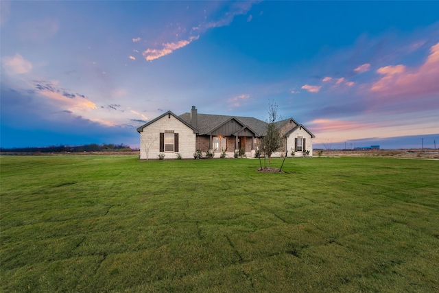 french provincial home featuring a lawn