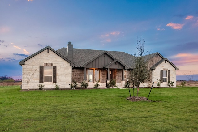 view of front of home with a yard