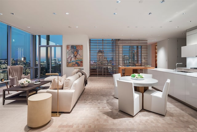 dining area with floor to ceiling windows and sink