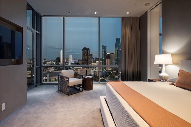 bedroom featuring floor to ceiling windows and carpet