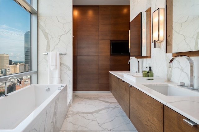 bathroom with a washtub and vanity