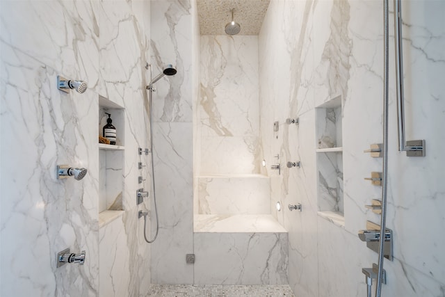 bathroom with a tile shower