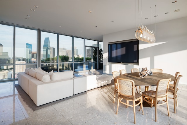 tiled dining area featuring a wealth of natural light and expansive windows