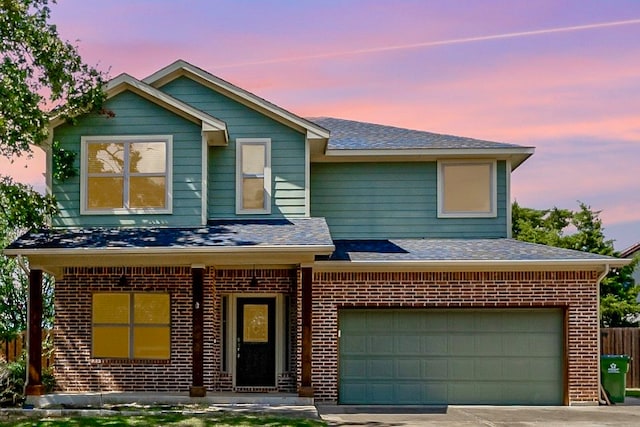 view of front of home featuring a garage and a porch