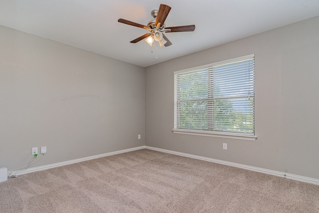 unfurnished room featuring carpet flooring and ceiling fan