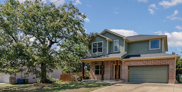 view of front of property with a porch and a garage