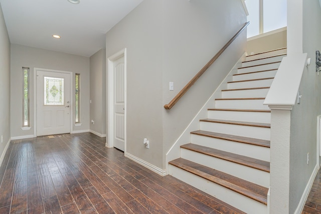 entryway with dark hardwood / wood-style floors