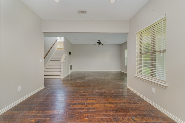 spare room featuring ceiling fan and dark hardwood / wood-style flooring