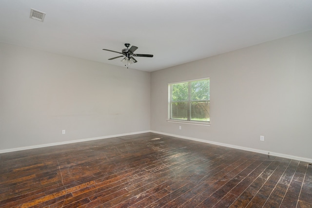 unfurnished room with dark wood-type flooring and ceiling fan