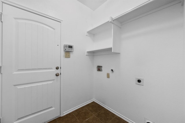 laundry area featuring gas dryer hookup, electric dryer hookup, washer hookup, and dark tile patterned flooring