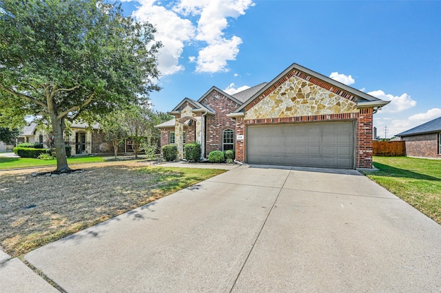 view of front facade featuring a front yard and a garage