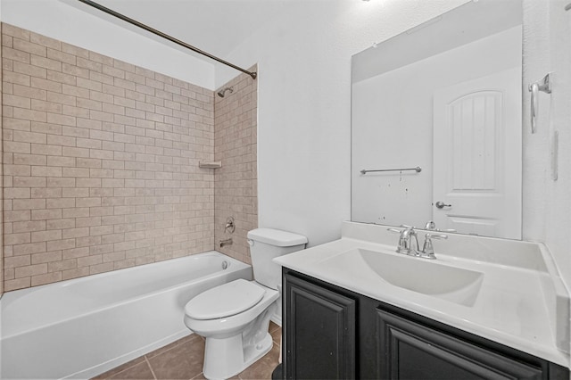 full bathroom with tiled shower / bath, vanity, toilet, and tile patterned flooring