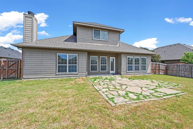 back of property featuring a lawn and a patio area