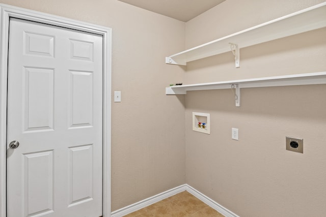 clothes washing area with hookup for a washing machine, light tile patterned floors, and hookup for an electric dryer