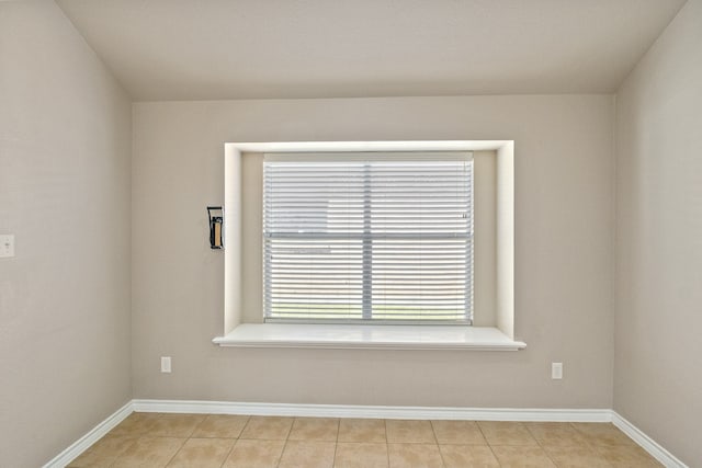 unfurnished room featuring light tile patterned flooring