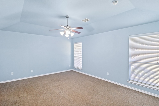 empty room with ceiling fan and carpet