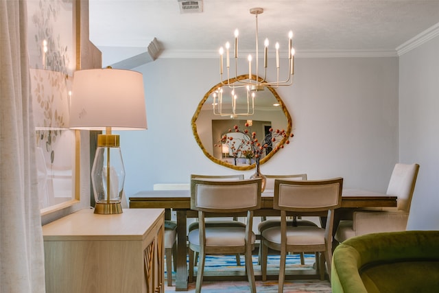 dining room featuring ornamental molding, wood-type flooring, and a chandelier