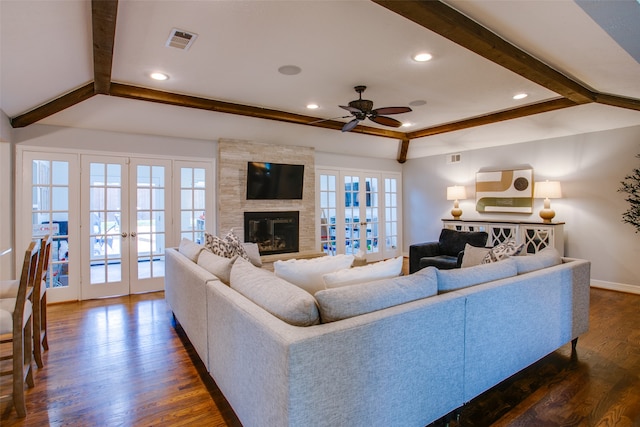 living room with french doors, a wealth of natural light, ceiling fan, and dark hardwood / wood-style floors