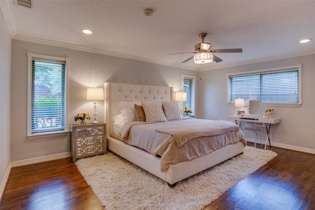 bedroom featuring ceiling fan, dark hardwood / wood-style floors, and ornamental molding