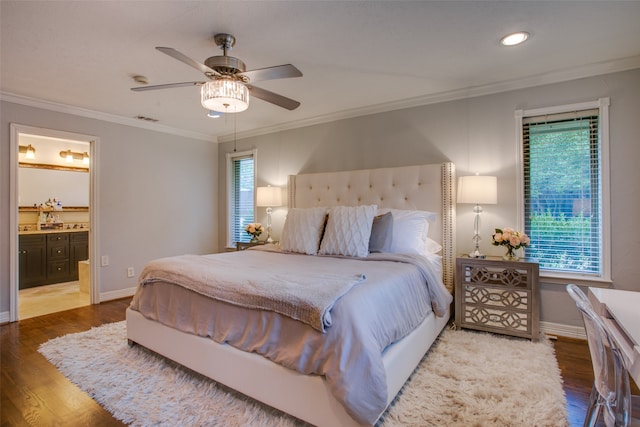 bedroom featuring ornamental molding, connected bathroom, hardwood / wood-style floors, and ceiling fan