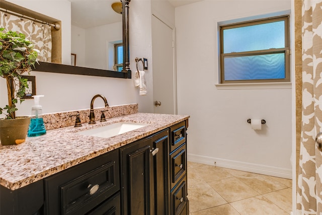 bathroom with vanity and tile patterned floors