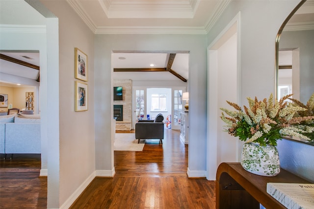 corridor with ornamental molding and dark hardwood / wood-style floors