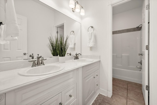 bathroom with vanity, tile patterned floors, and shower / washtub combination