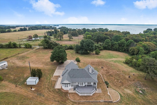 birds eye view of property featuring a rural view and a water view