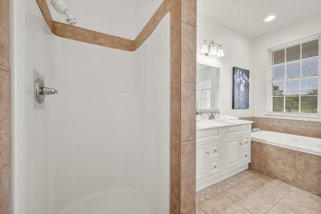 bathroom featuring vanity, independent shower and bath, and tile patterned floors