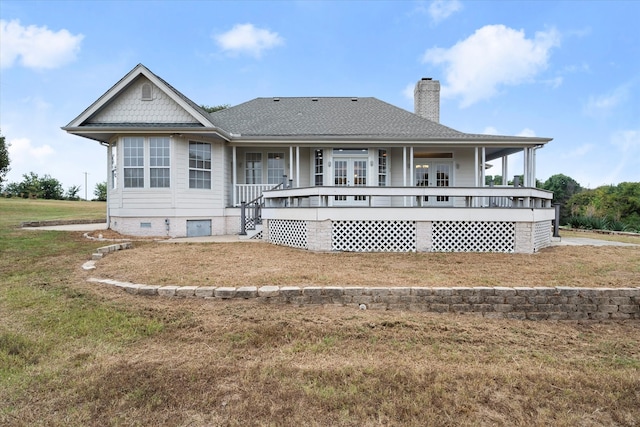 view of front of property with a front lawn and covered porch