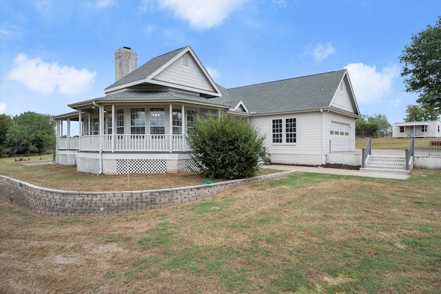 back of property featuring a porch and a lawn