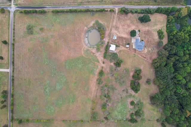 birds eye view of property with a rural view