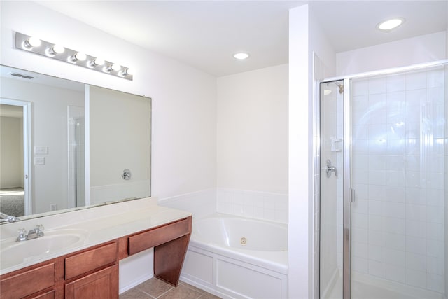 bathroom featuring plus walk in shower, tile patterned flooring, and vanity