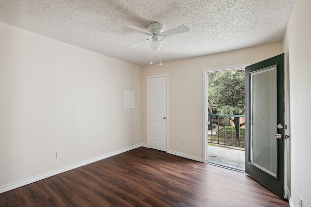 spare room with ceiling fan, dark hardwood / wood-style flooring, and a textured ceiling