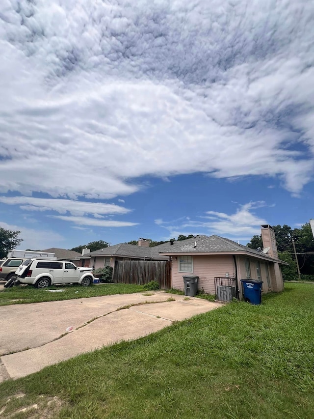 exterior space with a lawn