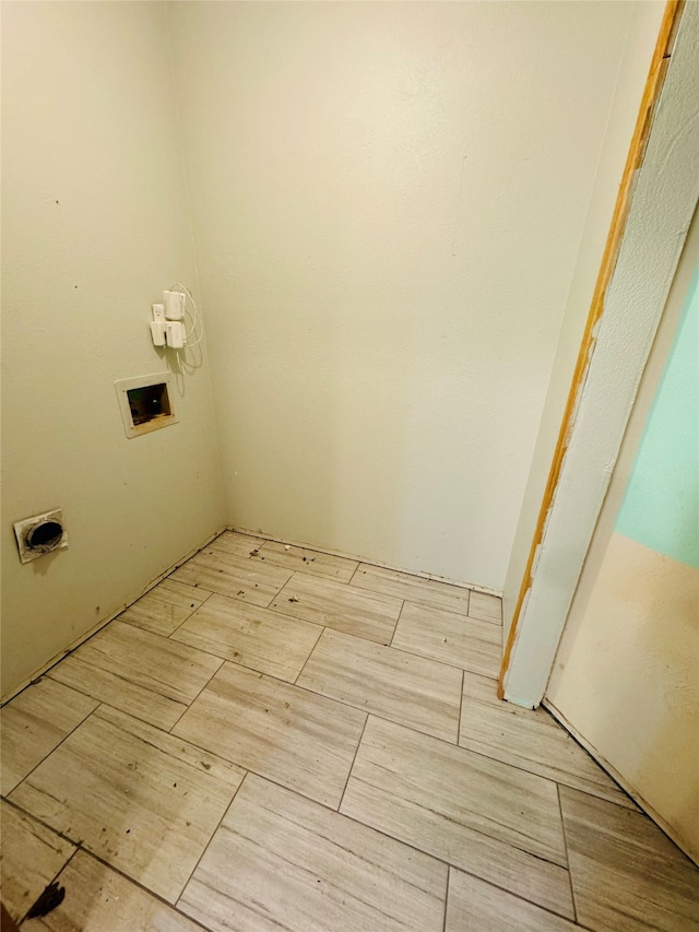 laundry room with washer hookup, light wood-type flooring, and hookup for an electric dryer