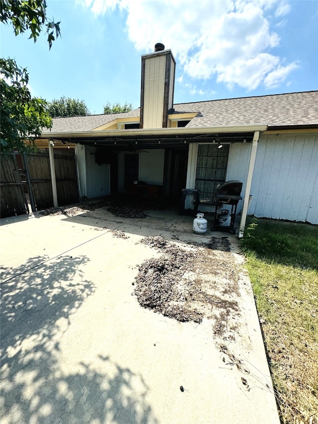 rear view of house featuring a patio