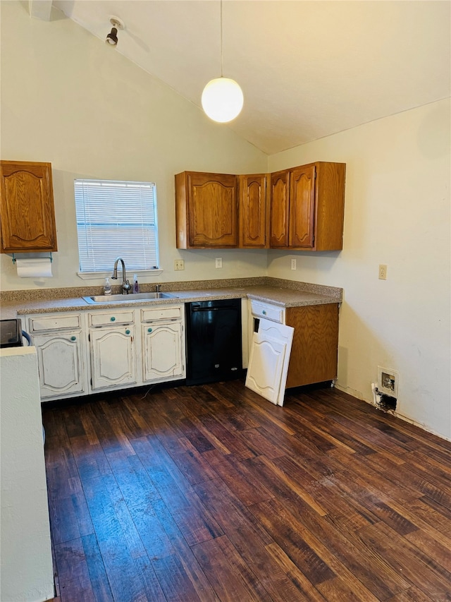 kitchen featuring lofted ceiling, black dishwasher, dark hardwood / wood-style floors, and sink