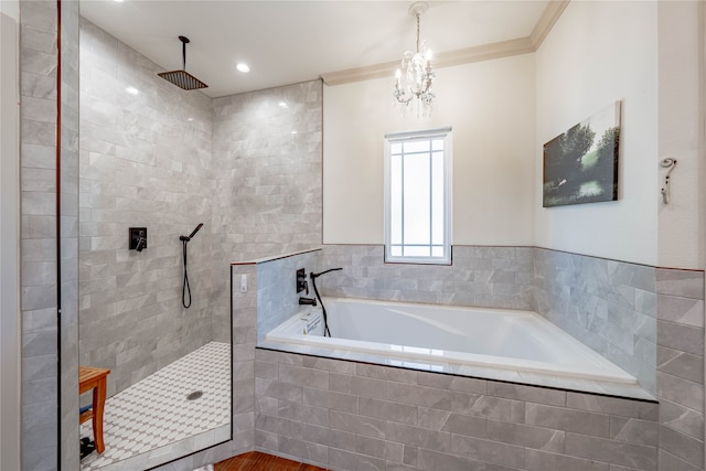 bathroom featuring a chandelier, crown molding, and plus walk in shower