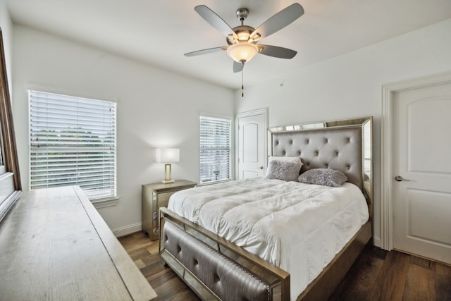 bedroom with ceiling fan and dark hardwood / wood-style floors