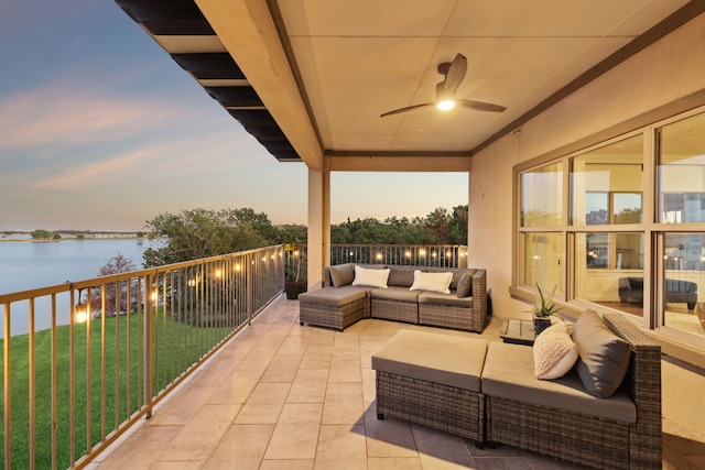 exterior space with a water view, ceiling fan, and outdoor lounge area