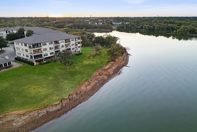 aerial view at dusk with a water view