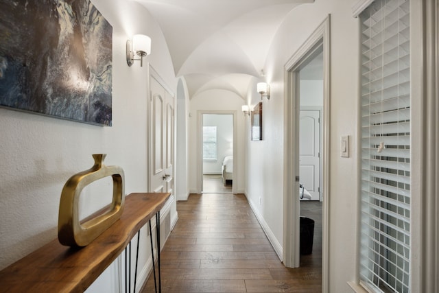 corridor with dark hardwood / wood-style floors